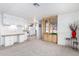 Living room with built-in hutch and view into the kitchen area at 205 S Higley Rd # 288, Mesa, AZ 85206