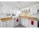White kitchen with wood countertops, stove, and ample cabinet space at 205 S Higley Rd # 288, Mesa, AZ 85206