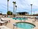 Relaxing community pool and spa area with lounge chairs and a hot tub at 205 S Higley Rd # 288, Mesa, AZ 85206