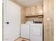 Laundry room with washer, dryer, and cabinets at 205 S Higley Rd # 288, Mesa, AZ 85206