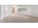 Spacious living room with built-in shelving and carpeting at 205 S Higley Rd # 288, Mesa, AZ 85206