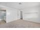 Simple bedroom with neutral walls and carpeting, plus a view of the bathroom at 205 S Higley Rd # 288, Mesa, AZ 85206