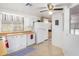 White kitchen cabinets and appliances with wood countertops at 205 S Higley Rd # 288, Mesa, AZ 85206