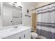 Clean bathroom with shower/tub, vanity, and striped curtain at 205 S Higley Rd # 288, Mesa, AZ 85206