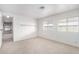 Bedroom with neutral walls, carpeting, and a view into the living room at 205 S Higley Rd # 288, Mesa, AZ 85206