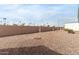 Large backyard with gravel and a wall at 205 S Higley Rd # 288, Mesa, AZ 85206
