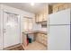 Simple kitchen with white cabinets and refrigerator at 205 S Higley Rd # 288, Mesa, AZ 85206