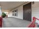 Covered porch with a security door leading into the home at 205 S Higley Rd # 288, Mesa, AZ 85206