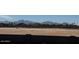 View of an empty lot with mountain views at 9986 W Cora W Ln, Avondale, AZ 85392