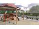 playground with play structures and shaded area at 9986 W Cora W Ln, Avondale, AZ 85392