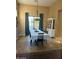 Bright dining room with a large table, and access to backyard at 4450 S Rio Dr, Chandler, AZ 85249
