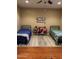 Two twin beds in a shared bedroom with wood floors at 4450 S Rio Dr, Chandler, AZ 85249