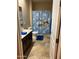 Clean bathroom with Toy Story themed shower curtain at 4450 S Rio Dr, Chandler, AZ 85249