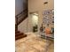 Spacious entryway, featuring a staircase and decorative wall art at 4450 S Rio Dr, Chandler, AZ 85249