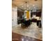 Kitchen with island, dark cabinetry, and tile flooring at 4450 S Rio Dr, Chandler, AZ 85249