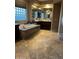 Spa-like bathroom with a large soaking tub and double vanity at 4450 S Rio Dr, Chandler, AZ 85249