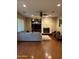 Living room with hardwood floors, fireplace, and built-in shelving at 4450 S Rio Dr, Chandler, AZ 85249