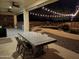 Outdoor patio with string lights and dining furniture at 4450 S Rio Dr, Chandler, AZ 85249