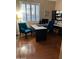 Home office with built-in shelving and hardwood floors at 4450 S Rio Dr, Chandler, AZ 85249
