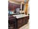 Island kitchen with granite countertops and lots of cabinet space at 4450 S Rio Dr, Chandler, AZ 85249