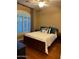 Cozy guest bedroom with hardwood floors and window seating at 4450 S Rio Dr, Chandler, AZ 85249