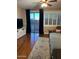 Main bedroom with hardwood floors, sliding door to balcony at 4450 S Rio Dr, Chandler, AZ 85249
