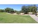Expansive green area with mature trees and a walking path at 15626 N 50Th St, Scottsdale, AZ 85254