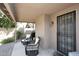 Relaxing patio area with wicker chairs and access to backyard at 15626 N 50Th St, Scottsdale, AZ 85254