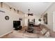 Spacious living room with vaulted ceiling, fireplace, and large sectional sofa at 15626 N 50Th St, Scottsdale, AZ 85254
