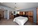 Spacious bedroom with built-in shelving and a ceiling fan at 15626 N 50Th St, Scottsdale, AZ 85254