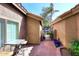 Brick paved patio with small table and chairs, and gated access at 15626 N 50Th St, Scottsdale, AZ 85254