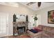 Stone fireplace with a wooden mantle and a sitting area at 15626 N 50Th St, Scottsdale, AZ 85254