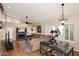 Bright living room with vaulted ceiling, fireplace, and hardwood floors at 15626 N 50Th St, Scottsdale, AZ 85254