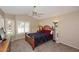 Spacious bedroom with a wooden bed frame and window seating at 15626 N 50Th St, Scottsdale, AZ 85254