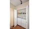 Bright laundry closet with full-size washer and dryer at 15626 N 50Th St, Scottsdale, AZ 85254