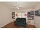 Cozy library with built-in shelving and a comfortable couch at 15626 N 50Th St, Scottsdale, AZ 85254