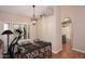 Cozy dining area with glass-top table and access to kitchen at 15626 N 50Th St, Scottsdale, AZ 85254