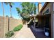 Backyard patio with seating area, grill, and block wall at 15626 N 50Th St, Scottsdale, AZ 85254