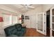 Bright library featuring a comfy couch and built-in shelving at 15626 N 50Th St, Scottsdale, AZ 85254