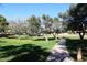 Scenic walking path surrounded by lush green grass and trees at 15626 N 50Th St, Scottsdale, AZ 85254