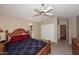 Comfortable bedroom with a wooden bed frame and ample closet space at 15626 N 50Th St, Scottsdale, AZ 85254