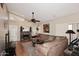 Spacious living room with vaulted ceiling, fireplace, and large sectional sofa at 15626 N 50Th St, Scottsdale, AZ 85254
