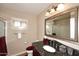 Elegant bathroom with granite countertops and a large mirror at 15626 N 50Th St, Scottsdale, AZ 85254