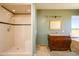Bathroom with a walk-in shower, vanity with granite top, and soaking tub at 29408 N 244Th Dr, Wittmann, AZ 85361