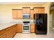 Modern kitchen with granite countertops and stainless steel appliances at 29408 N 244Th Dr, Wittmann, AZ 85361
