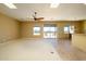 Bright living room with sliding glass doors leading to backyard patio at 29408 N 244Th Dr, Wittmann, AZ 85361