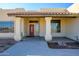Inviting exterior with terracotta tile roof and covered entryway at 29408 N 244Th Dr, Wittmann, AZ 85361