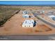 Aerial view of new homes under construction in a desert community at 29408 N 244Th Dr, Wittmann, AZ 85361