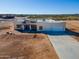 New construction home with two-car garage and desert landscaping at 29408 N 244Th Dr, Wittmann, AZ 85361