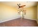 Open living room with wood flooring and views into the kitchen area at 29408 N 244Th Dr, Wittmann, AZ 85361